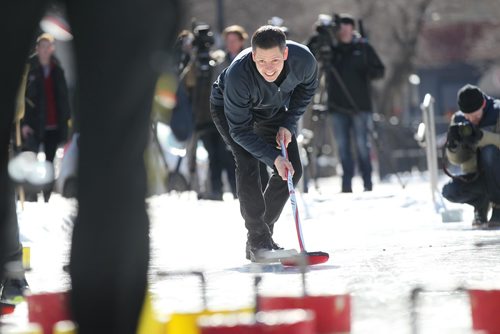 RUTH BONNEVILLE / WINNIPEG FREE PRESS

Winnipeg Mayor Brian Bowman amassed some of the greatest curling talent in Manitoba to compete against representatives of the Exchange District Biz in a fun curling match celebrating winters increasing coolness, Canadas Olympic and burgeoning athletic talent at Old Market Square Thursday.  
Winnipeg Mayor Brian Bowman curls with    Kaitlyn Lawes Olympic gold medalist and 
 Jeff Stoughton, (Team Canada mixed doubles coach) along with other curlers and members of the Exchange District Biz.

Standup photos 
March 01,18