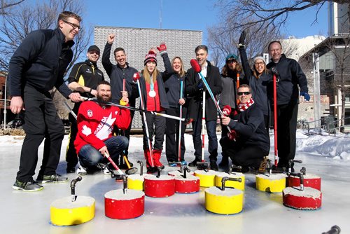 RUTH BONNEVILLE / WINNIPEG FREE PRESS

Winnipeg Mayor Brian Bowman amassed some of the greatest curling talent in Manitoba to compete against representatives of the Exchange District Biz in a fun curling match celebrating winters increasing coolness, Canadas Olympic and burgeoning athletic talent at Old Market Square Thursday.  
Group photo of Winnipeg Mayor Brian Bowman  with    Kaitlyn Lawes Olympic gold medalist and 
 Jeff Stoughton, (Team Canada mixed doubles coach) along with other curlers and members of the Exchange District Biz.

Standup photos 
March 01,18