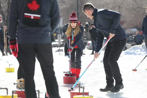 RUTH BONNEVILLE / WINNIPEG FREE PRESS

Winnipeg Mayor Brian Bowman amassed some of the greatest curling talent in Manitoba to compete against representatives of the Exchange District Biz in a fun curling match celebrating winters increasing coolness, Canadas Olympic and burgeoning athletic talent at Old Market Square Thursday.  
Photo of Winnipeg Mayor Brian Bowman with  Kaitlyn Lawes Olympic gold medalist along with other curlers and members of the Exchange District Biz.

Standup photos 
March 01,18