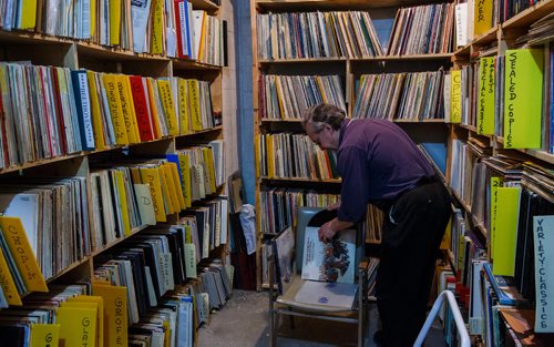 MIKE DEAL / WINNIPEG FREE PRESS
Dennis Henney, volunteer since the 1980's, organizes and puts away "new" records in the classical section of the Manitoba Chamber Orchestra's Vinyl Vault in the basement of the Power Building on Portage Ave. where volunteers open the doors once a month, and record collectors pour in, looking for treasures among the 7,000 or so titles on the shelves. The money from the sales of the records goes towards funding the Manitoba Chamber Orchestra and it's community outreach programs.
180224 - Saturday, February 24, 2018.