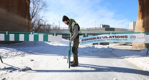 RUTH BONNEVILLE / WINNIPEG FREE PRESS

The Forks River Trail staff close off the trail on the Assiniboine River west bound at the Forks Friday.  

March 01,18