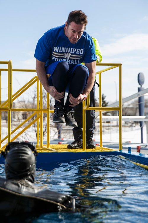 MIKE DEAL / WINNIPEG FREE PRESS
Winnipeg Blue Bombers GM Kyle Walters jumps into the tank to raise money for Special Olympics Manitoba. Participants jump into the deep end of a specially made tank at Investors Group Stadium Saturday afternoon in an event organized by the Law Enforcement Torch Run which raised more than $25,000 last year.
180303 - Saturday, March 03, 2018.