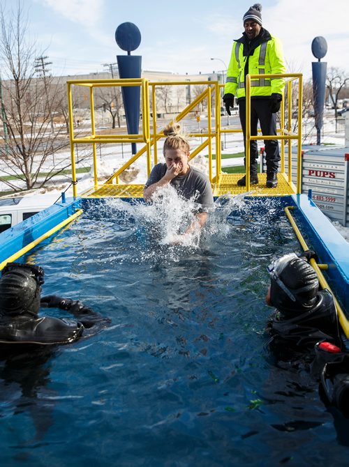 MIKE DEAL / WINNIPEG FREE PRESS
Melissa McFarlane jumps into the tank to raise money for Special Olympics Manitoba. Participants jump into the deep end of a specially made tank at Investors Group Stadium Saturday afternoon in an event organized by the Law Enforcement Torch Run which raised more than $25,000 last year.
180303 - Saturday, March 03, 2018.