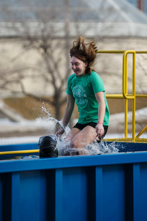 MIKE DEAL / WINNIPEG FREE PRESS
Kailey Niemi jumps into the tank to raise money for Special Olympics Manitoba. Participants jump into the deep end of a specially made tank at Investors Group Stadium Saturday afternoon in an event organized by the Law Enforcement Torch Run which raised more than $25,000 last year.
180303 - Saturday, March 03, 2018.
