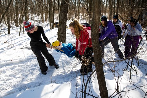 MIKE DEAL / WINNIPEG FREE PRESS
Emma Beckstead (left) along with other members of the 82nd Pathfinders "She Wolves" pulls on a stretcher the team made in order to transport a team member, Hana Nedohin-macek, through the woods.
350 youth will compete this weekend in the 47th annual Klondike Derby at Scouts Canada's Camp Amisk, just south of the Perimeter Highway. They will demonstrate winter survival skills, learn teamwork and "make new friends." Hosted by Scouts Canada, the Klondike Derby features teams of six to eight Cub Scouts, Girl Guides, Scouts and Pathfinders pulling a Klondike-style sleigh on a 2.5-km journey through the woods. 
180303 - Saturday, March 03, 2018.