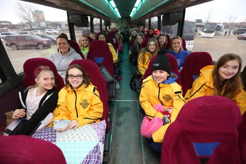 TREVOR HAGAN / WINNIPEG FRESS
From left, Piper Gillson, 11, Alyssa Champagne, 12, Soleil Laninga and Emma Loepky, 14, all gymnasts with Winnipeg Gold, waiting on their bus to Thompson to compete in the Manitoba Games, Sunday, March 3, 2018.