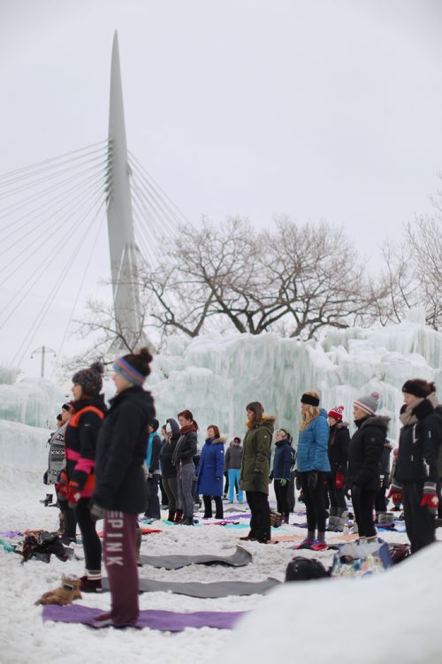 TREVOR HAGAN / WINNIPEG FRESS
People take part in a yoga class inside the Ice Castle at Parks Canada at the Forks National Historic Site, Sunday, March 3, 2018.