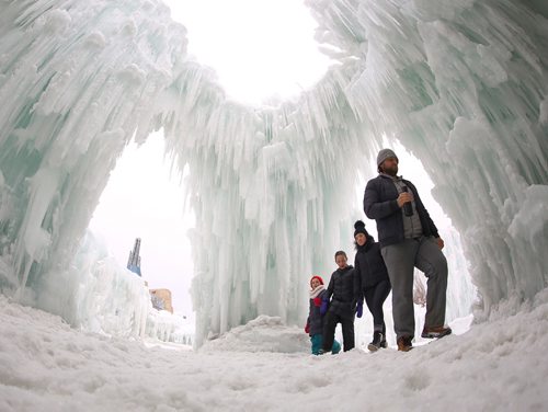 TREVOR HAGAN / WINNIPEG FRESS
Michael Palmer leads Lana Bakun and their friends kids, Pilot 10 and Poet Kostenchuk, 7, in the Ice Castle in the Parks Canada site at The Forks, Sunday, March 3, 2018.