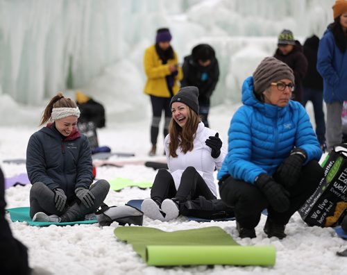 TREVOR HAGAN / WINNIPEG FREE PRESS
Lauren Whittaker and Elizabeth Honey wait for the start of a yoga class in the Ice Castle at the Parks Canada site at The Forks, Sunday, March 4, 2018.