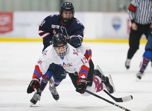 JOHN WOODS / WINNIPEG FREE PRESS
St Mary's Academy Flames' Sarah Dennehy (8) trips Gentry Academy Galaxy's Jace Zapata (12) in Winnipeg Sunday, March 4, 2018. St Mary's went on to defeat Gentry on overtime to win the 2018 Female World Sport School Challenge.