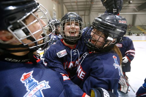 JOHN WOODS / WINNIPEG FREE PRESS
St Mary's Academy Flames', from left,  Ashley McFadden (13), Kate Bumstead (7) celebrate with overtime game winning goal scorer Danica Namaka (19) as they defeat Gentry Academy Galaxy in the 2018 Female World Sport School Challenge in Winnipeg Sunday, March 4, 2018.