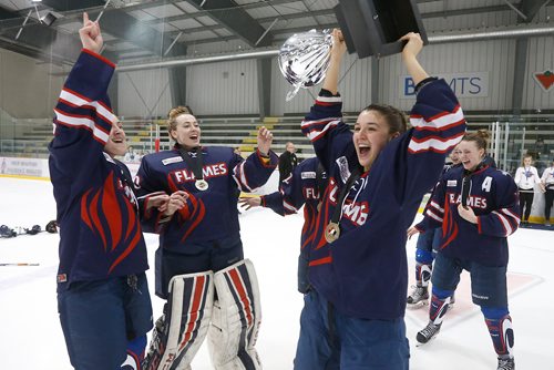JOHN WOODS / WINNIPEG FREE PRESS
St Mary's Academy Flames' captain Ashley McFadden (13) raises the cup after defeating the Gentry Academy Galaxy in the 2018 Female World Sport School Challenge in Winnipeg Sunday, March 4, 2018.
