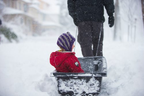 MIKAELA MACKENZIE / WINNIPEG FREE PRESS
Sydney Cumming, four, gets pulled down the sidewalk in a sled by her dad, Andy Cumming, in Winnipeg, Manitoba on Monday, March 5, 2018.
180305 - Monday, March 05, 2018.