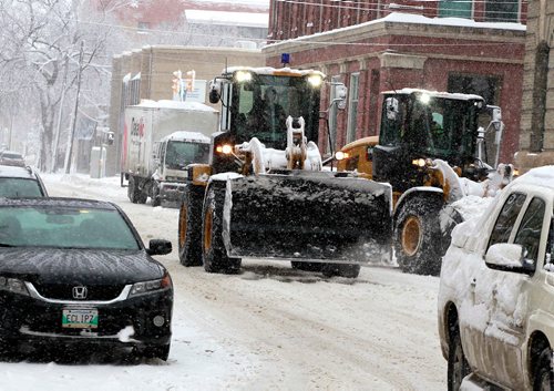 BORIS MINKEVICH / WINNIPEG FREE PRESS
Winter storm grips Winnipeg today. A snow plow fights the battle in the Exchange District on McDermot Avenue near Arthur Street. March 5, 2018