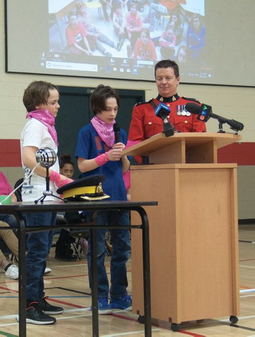Canstar Community News Feb. 28, 2018 - Two students from Maple Leaf School (251 McIvor Ave.) presented their anti-bullying film during the Red Cross Pink Day assembly, which was live-streamed to participating schools in communities across Manitoba and Nunavut. (SHELDON BIRNIE/CANSTAR/THE HERALD)