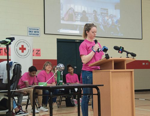 Canstar Community News Feb. 28, 2018 - University of Manitoba Bisons' hockey player Karissa Kirkup spoke to students at Maple Leaf School (251 McIvor Ave.) during the Red Cross Pink Day assembly, which was live-streamed to participating schools in communities across Manitoba and Nunavut. (SHELDON BIRNIE/CANSTAR/THE HERALD)