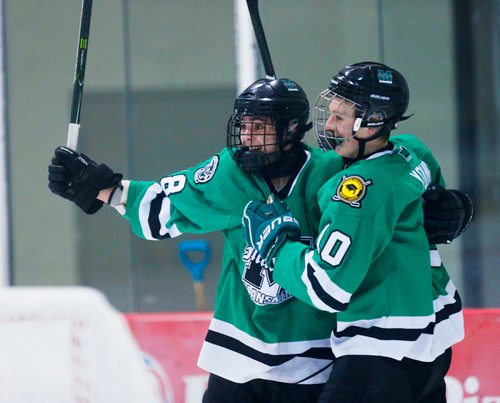 MIKAELA MACKENZIE / WINNIPEG FREE PRESS
Murdoch MacKay Clansmen Justin Wiersema (left) and Marcus Young celebrate their second goal in a game against the Leo-Remillard Renards at the MTS Iceplex in Winnipeg, Manitoba on Tuesday, March 6, 2018. The Clansmen won the game 3-1 in the C division high school hockey tournament.
180306 - Tuesday, March 06, 2018.