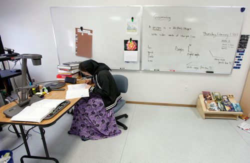 PHIL HOSSACK / WINNIPEG FREE PRESS - Doris Wurtz prepares lessons in her classroom at the Baker Community School. She teaches middle grades math to students on the colony and via internet "virtual" classroom to other communities. -See Melissa Martin's story.  - February 23, 2018