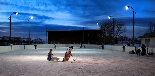 PHIL HOSSACK / WINNIPEG FREE PRESS - Women and children at the Baker Community gather on the ice after school. -See Melissa Martin's story.  - February 23, 2018