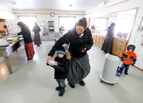PHIL HOSSACK / WINNIPEG FREE PRESS - Karissa Maendel and her son Liam pick up supper in the community dining hall at Baker Colony. Youngsters eat in the family home up to the age of 6 when they join other children in the communal dining hall next to the adults. -See Melissa Martin's story.  - February 23, 2018
