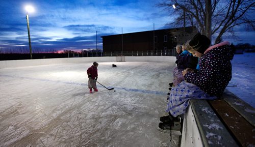 PHIL HOSSACK / WINNIPEG FREE PRESS - Women and children at the Baker Community gather on the ice after school. -See Melissa Martin's story.  - February 23, 2018