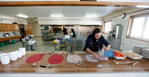 PHIL HOSSACK / WINNIPEG FREE PRESS - Tirzah Maendel sets up the supper buffet as she takes her turn preparing the daily meals at the colony. Women rotate through kitchen duties and the community eats communally -See Melissa Martin's story.  - February 23, 2018