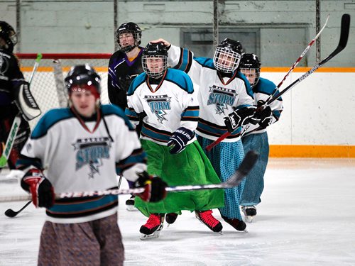 PHIL HOSSACK / WINNIPEG FREE PRESS - Celebrating, Tirzah Maendel taps Jessica Maendel for a nice pass leading to Tirzah scoring against the Iron Maidens . See Melissa Martin's story. February 23, 2018