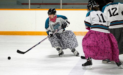 PHIL HOSSACK / WINNIPEG FREE PRESS - Skirts fly as Hannah Maendel turns things around and the Baker Storm charge with the puck against the Iron Maidens. See Melissa Martin's story. February 23, 2018