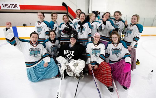 PHIL HOSSACK / WINNIPEG FREE PRESS - THe Baker Storm pose for a team photo after playing the Iron Maidens in MacGregor for the 9th annual charity game. See Melissa Martin's story. February 23, 2018