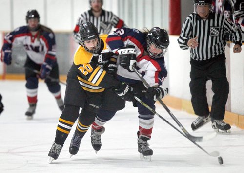 PHIL HOSSACK / WINNIPEG FREE PRESS -  Dakota Lancer ##20 Brooklyn Olfert reaches around St. Marys Acadamy #12 Ally Rakowski in playoff action at the Dakota Community Centre Wednesday afternoon. - March 7, 2018.