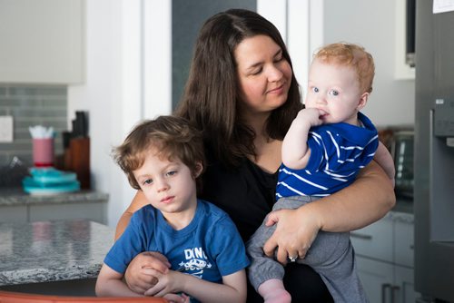 MIKAELA MACKENZIE / WINNIPEG FREE PRESS
Mom Jamie Streilein and her sons Keaton, three (left), and Elliot, nine months, at their home in Sage Creek in Winnipeg, Manitoba on Sunday, March 11, 2018. The Streilein family, as well as others in the subdivision, have little to no hope of getting their kids into the school in the area.
180311 - Sunday, March 11, 2018.