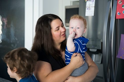 MIKAELA MACKENZIE / WINNIPEG FREE PRESS
Mom Jamie Streilein and her sons Keaton, three, and Elliot, nine months, at their home in Sage Creek in Winnipeg, Manitoba on Sunday, March 11, 2018. The Streilein family, as well as others in the subdivision, have little to no hope of getting their kids into the school in the area.
180311 - Sunday, March 11, 2018.