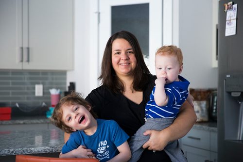 MIKAELA MACKENZIE / WINNIPEG FREE PRESS
Mom Jamie Streilein and her sons Keaton, three (left), and Elliot, nine months, at their home in Sage Creek in Winnipeg, Manitoba on Sunday, March 11, 2018. The Streilein family, as well as others in the subdivision, have little to no hope of getting their kids into the school in the area.
180311 - Sunday, March 11, 2018.