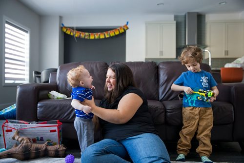 MIKAELA MACKENZIE / WINNIPEG FREE PRESS
Mom Jamie Streilein and her sons Keaton, three, and Elliot, nine months, at their home in Sage Creek in Winnipeg, Manitoba on Sunday, March 11, 2018. The Streilein family, as well as others in the subdivision, have little to no hope of getting their kids into the school in the area.
180311 - Sunday, March 11, 2018.