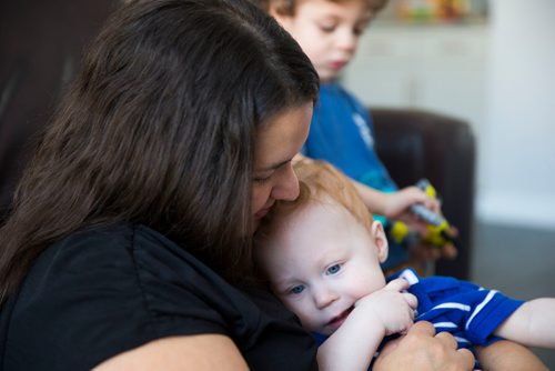 MIKAELA MACKENZIE / WINNIPEG FREE PRESS
Mom Jamie Streilein and her sons Keaton, three, and Elliot, nine months, at their home in Sage Creek in Winnipeg, Manitoba on Sunday, March 11, 2018. The Streilein family, as well as others in the subdivision, have little to no hope of getting their kids into the school in the area.
180311 - Sunday, March 11, 2018.