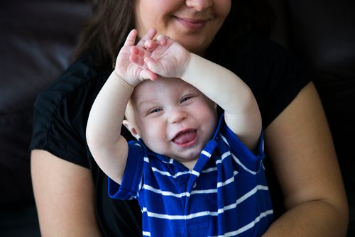 MIKAELA MACKENZIE / WINNIPEG FREE PRESS
Mom Jamie Streilein and her son Elliot, nine months, at their home in Sage Creek in Winnipeg, Manitoba on Sunday, March 11, 2018. The Streilein family, as well as others in the subdivision, have little to no hope of getting their kids into the school in the area.
180311 - Sunday, March 11, 2018.
