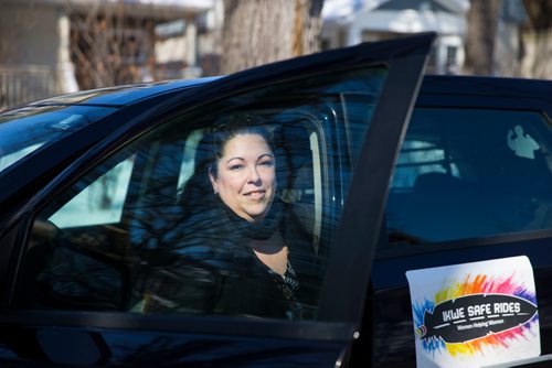 MIKAELA MACKENZIE / WINNIPEG FREE PRESS
Christine Brouzes, co-director of Ikwe Safe Rides - Women Helping Women, poses with her car on McMillan Avenue in Winnipeg, Manitoba on Sunday, March 11, 2018.
 Mikaela MacKenzie / Winnipeg Free Press 11, 2018.