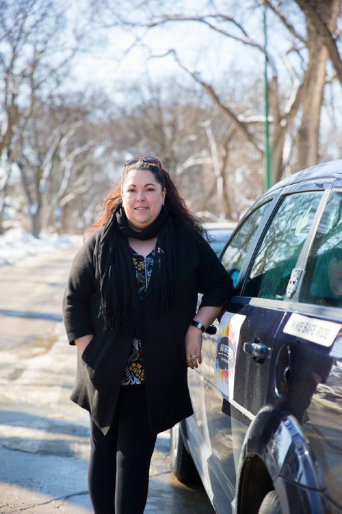 MIKAELA MACKENZIE / WINNIPEG FREE PRESS
Christine Brouzes, co-director of Ikwe Safe Rides - Women Helping Women, poses with her car on McMillan Avenue in Winnipeg, Manitoba on Sunday, March 11, 2018.
 Mikaela MacKenzie / Winnipeg Free Press 11, 2018.