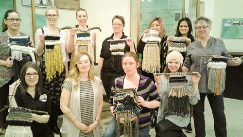 Canstar Community News Photo by Suzanne Hunter 
Participants in The Art of Weaving workshop at the Transcona Museum show off their creations.