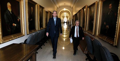 PHIL HOSSACK / WINNIPEG FREE PRESS -  Flanked by portraits of previous Speakers of the House, Chisholm Pothier DIrector of Communications walks Premier Brian Pallister to a press conference after the budget reading at the Manitoba Legislature Monday.  - March 12, 2018
