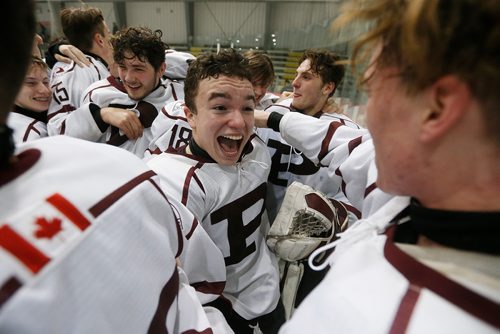 JOHN WOODS / WINNIPEG FREE PRESS
St Paul's Ethan Lewis (19) celebrates with teammate as they defeat Sturgeon Heights Collegiate in the AAAA Provincial High School Hockey Championship final Monday, March 12, 2018.