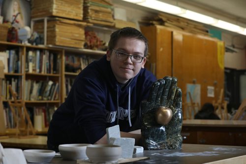 RUTH BONNEVILLE / WINNIPEG FREE PRESS

Grade 12 Sister High School Art student  Donovan Saunders, pictured here with his award winning soapstone sculpture called The Hand of Economy, in his art class at Sisler Tuesday.  

Saunder's sculpture recently won an honourable mention at Eksperimenta! exhibition in Tallinn, Estonia. 

Sister is proud of all the Sisler art students whose art work was selected to be shown at the prestigious exhibition around hundreds of entries from around the world.   Names of Sisler students whose work was in competition: Francis Novilla, Jenna Li, Aaron Legaspi & Ellina Pe Benito, JR Millar, Angela Aguila, Vincent Reyes and Donovan Saunders.   

The theme for the triennial event was Art and the Economy, and artists from all over the world competed to have their works seen on an international stage.  

Standup 

March 13 ,2018