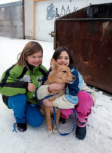 BORIS MINKEVICH / WINNIPEG FREE PRESS  081201 Calli Vanderaa, right, and her friend Sabannah Cadotte with the dog Calli found in a dumpster in behind their house.