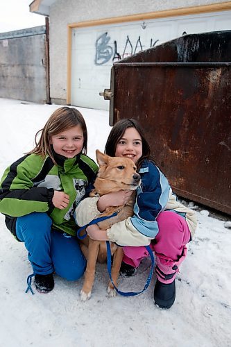 BORIS MINKEVICH / WINNIPEG FREE PRESS  081201 Calli Vanderaa, right, and her friend Sabannah Cadotte with the dog Calli found in a dumpster in behind their house.