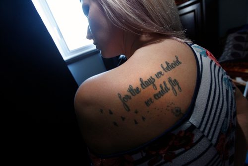 PHIL HOSSACK / WINNIPEG FREE PRESS - Hedley fan Toni-Dawn McGrath shows off her tattoo, a quote from one of the bands songs, on her right shoulder. See Jenn Zorati's story. - March 14, 2018