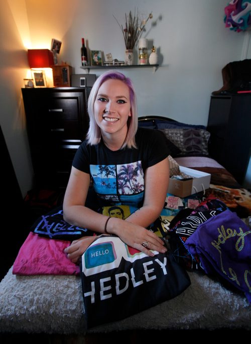 PHIL HOSSACK / WINNIPEG FREE PRESS - Hedley fan Toni-Dawn McGrath poses with some of the souviniers she's collected from the Band's Concerts. See Jenn Zorati's story. - March 14, 2018