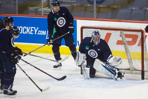 MIKE DEAL / WINNIPEG FREE PRESS
Winnipeg Jets' goaltender Eric Comrie (1) during practice at Bell MTS Place Thursday morning prior to a home game against the Chicago Blackhawks.
180315 - Thursday, March 15, 2018.