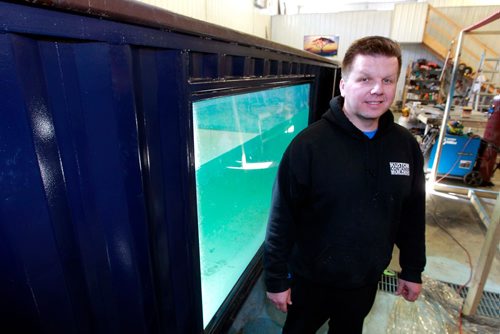 BORIS MINKEVICH / WINNIPEG FREE PRESS
Kurt Wittin owns Custom Container Builders and makes portable swimming pools in his Springfield, MB business. In this photo he poses with one of his container pools. MARTIN CASH STORY. March 15, 2018