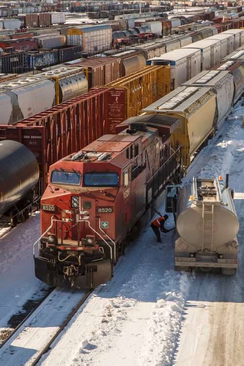 MIKE DEAL / WINNIPEG FREE PRESS
Trains in the CP rail yard sit idle Thursday afternoon.
180315 - Thursday, March 15, 2018.