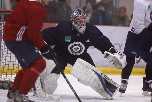 RUTH BONNEVILLE  /  WINNIPEG FREE PRESS

Jets Goalie, Eric Comrie on ice during practice with The Winnipeg Jets at MTS Iceplex Saturday. 

March 17, 2018